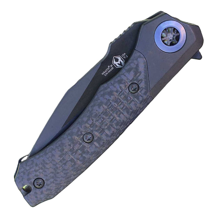 Heretic Wraith Manual Flipper Knife 3.625" CPM-MagnaCut Black DLC Battle Worn Clip Point Combo Integral Battle Worn DLC Titanium Handle Carbon Fiber Serrated